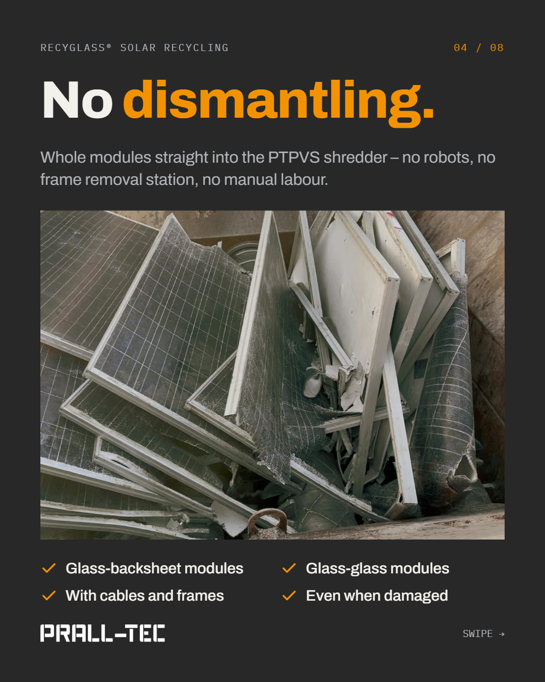 Whole PV modules with frames and cables in a shredder feed hopper. Glass-backsheet and glass-glass modules are processed, even when damaged.